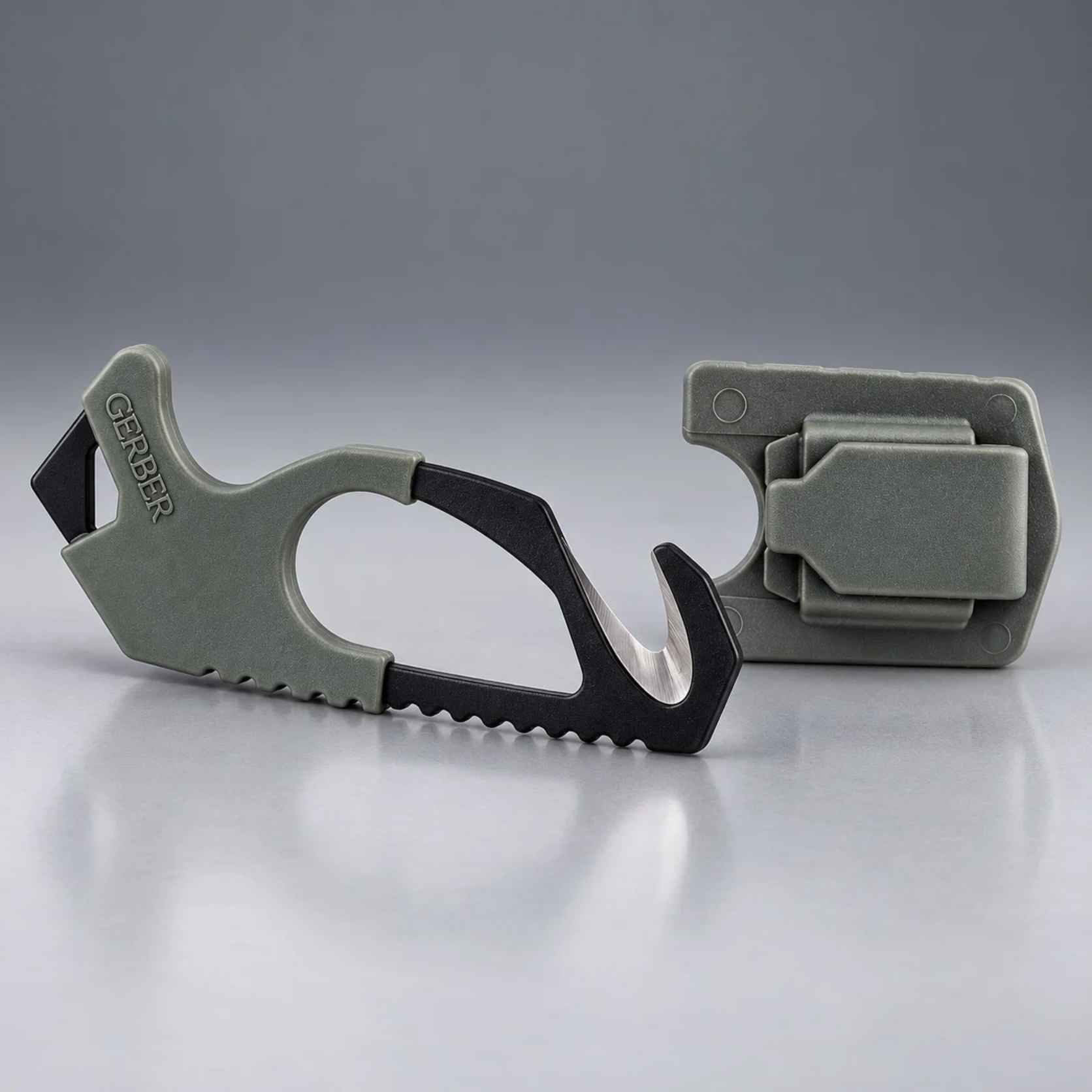 Gerber Gear Strap Cutter 22-01943 in Foliage Green with black 420HC hook blade beside its matching molded sheath