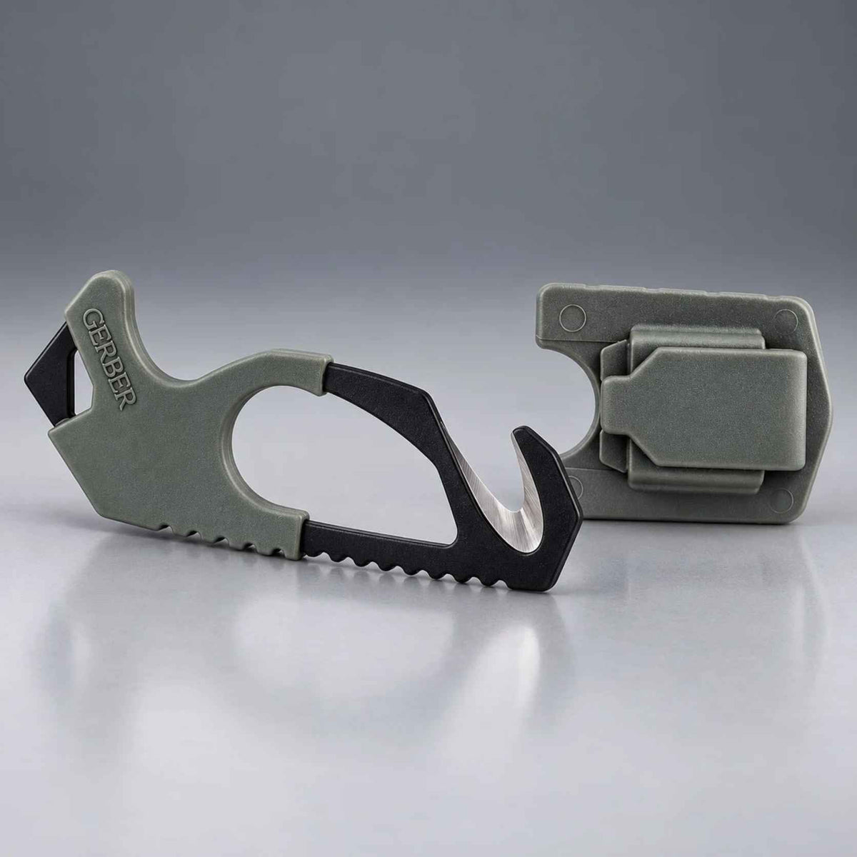 Gerber Gear Strap Cutter 22-01943 in Foliage Green with black 420HC hook blade beside its matching molded sheath