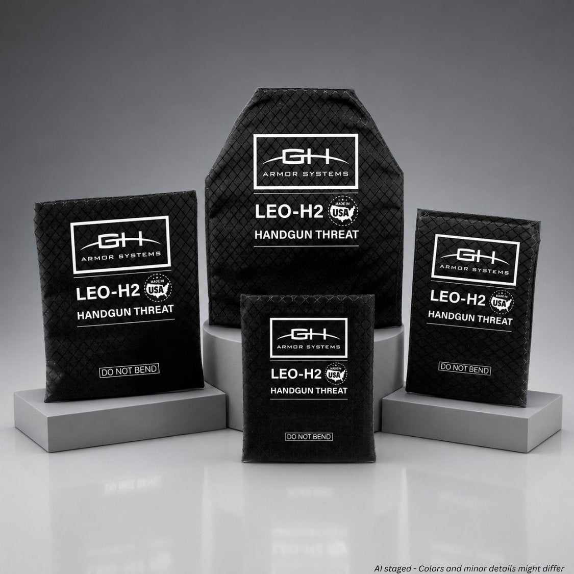 Black armor plates with 'GH Armor Systems' branding on a gray background