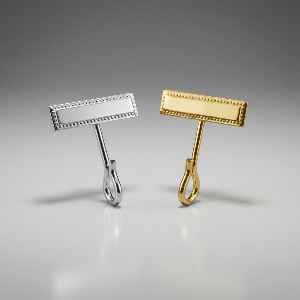 Gold and silver Hero's Pride Uniform Whistle Hooks 4015 on a gray background