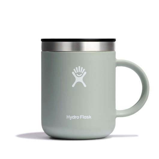 Hydro Flask insulated mug in soft green with stainless steel lid, ideal for keeping beverages hot for hours.