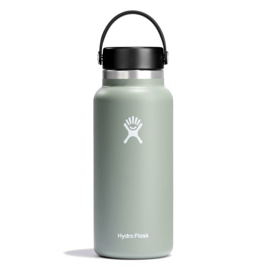 Hydro Flask wide mouth insulated water bottle in green with black flex cap, perfect for keeping drinks cold or hot.