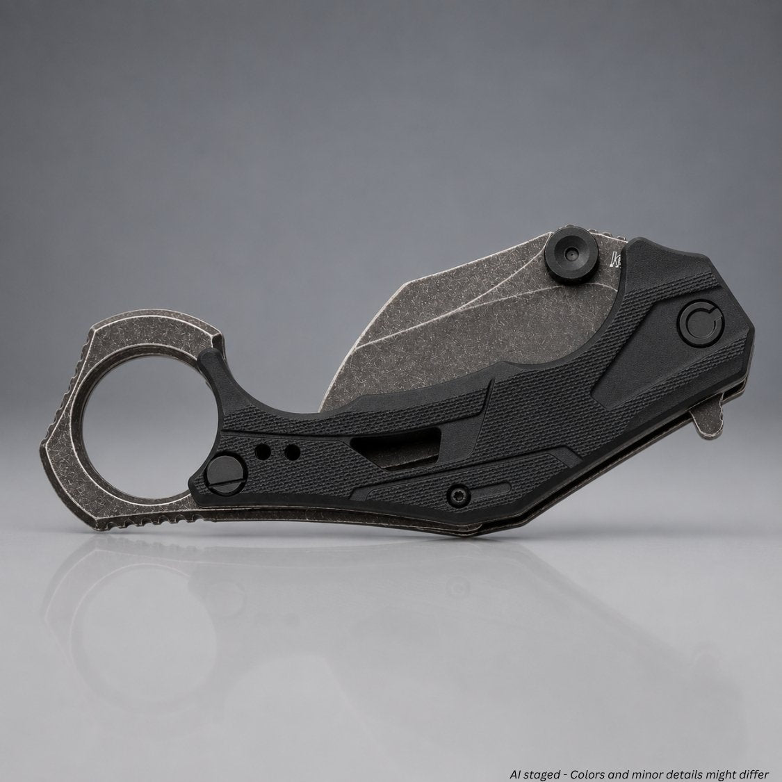 Kershaw Outlier 2064 karambit folding knife closed left side, reversible BlackWash deep-carry pocket clip on gray nylon handle