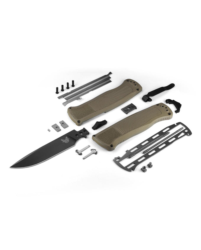 Knife assembly kit with blade, handle, and metal components on a white background