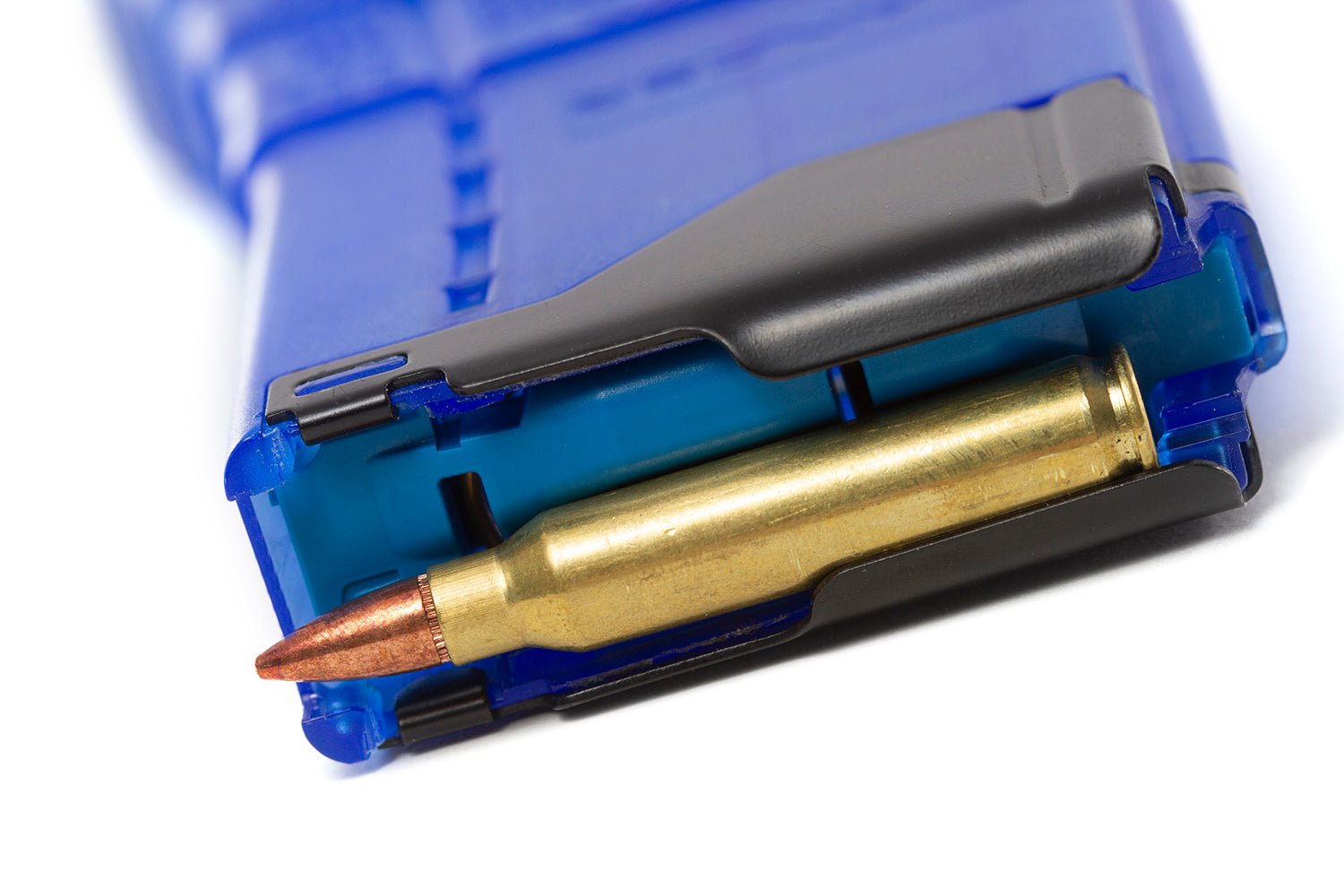 Close-up of a rifle magazine with a cartridge on a white background