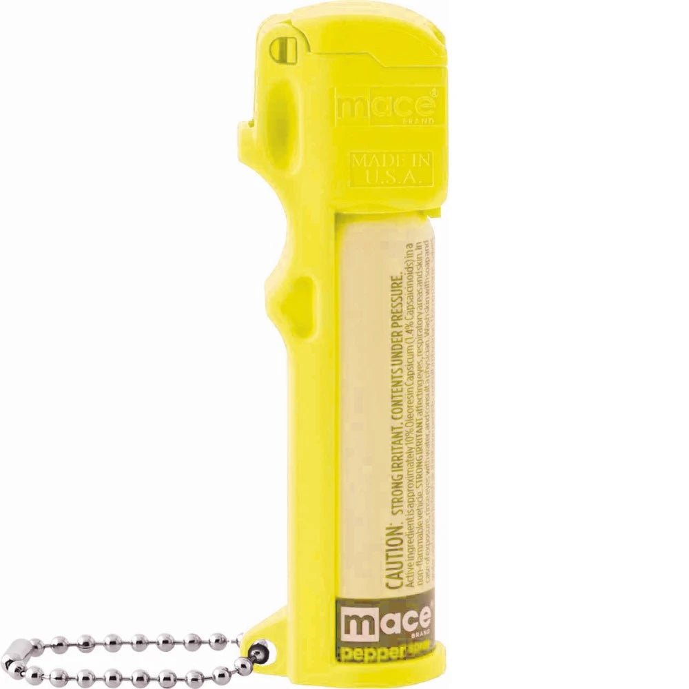 MACE Personal Pepper Spray in bright yellow for self-defense, featuring safety controls for reliable use.