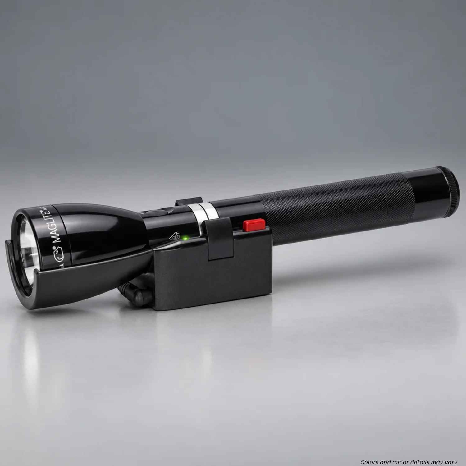 Maglite ML150LR flashlight seated in the ML150-A2015 charging cradle with green charge light on