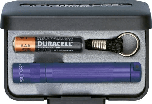 Maglite Solitaire flashlight set with Duracell AAA battery, keychain, and storage case for portable illumination.