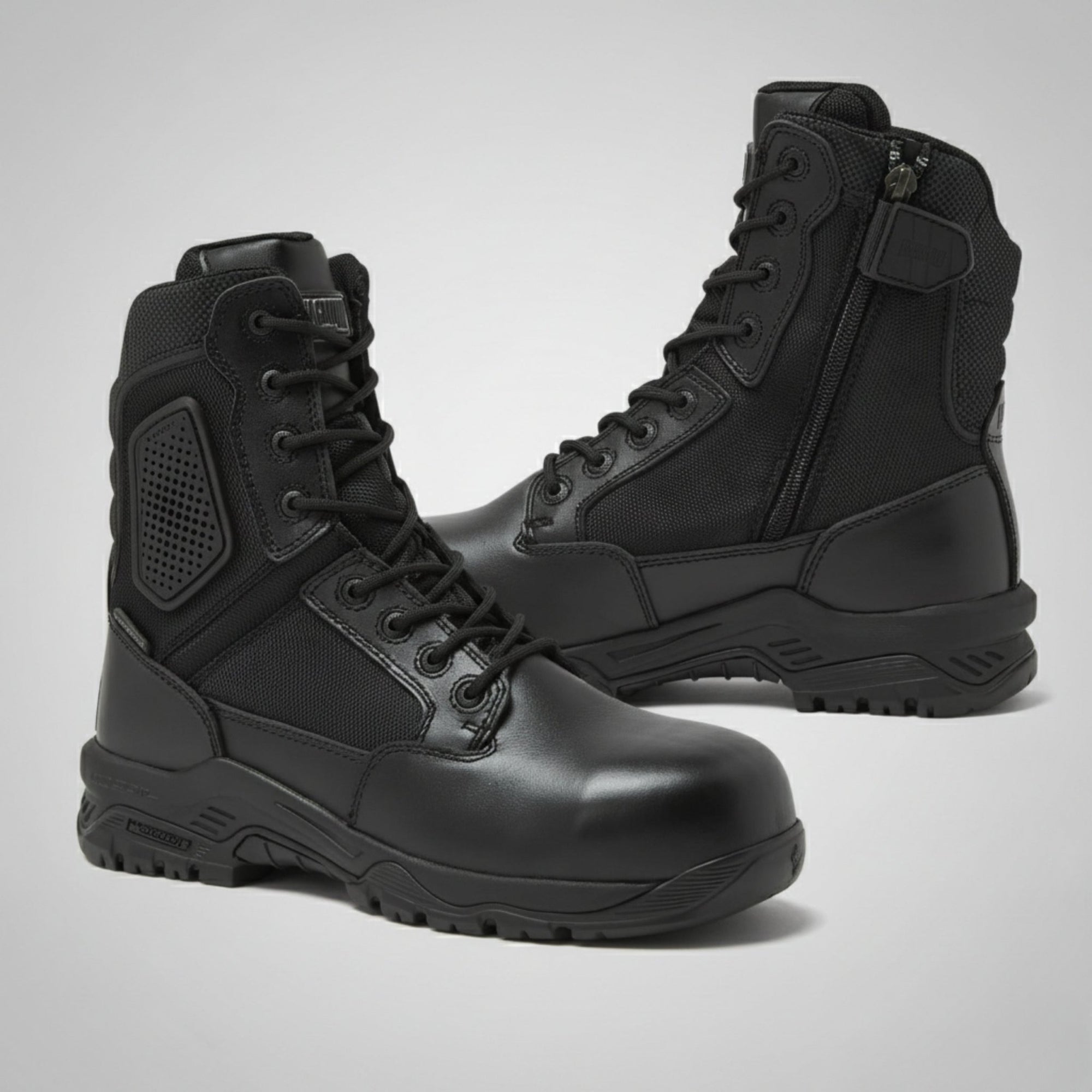 Pair of black Magnum Boots Strike Force 8" Side-Zip Boots on a light gray background