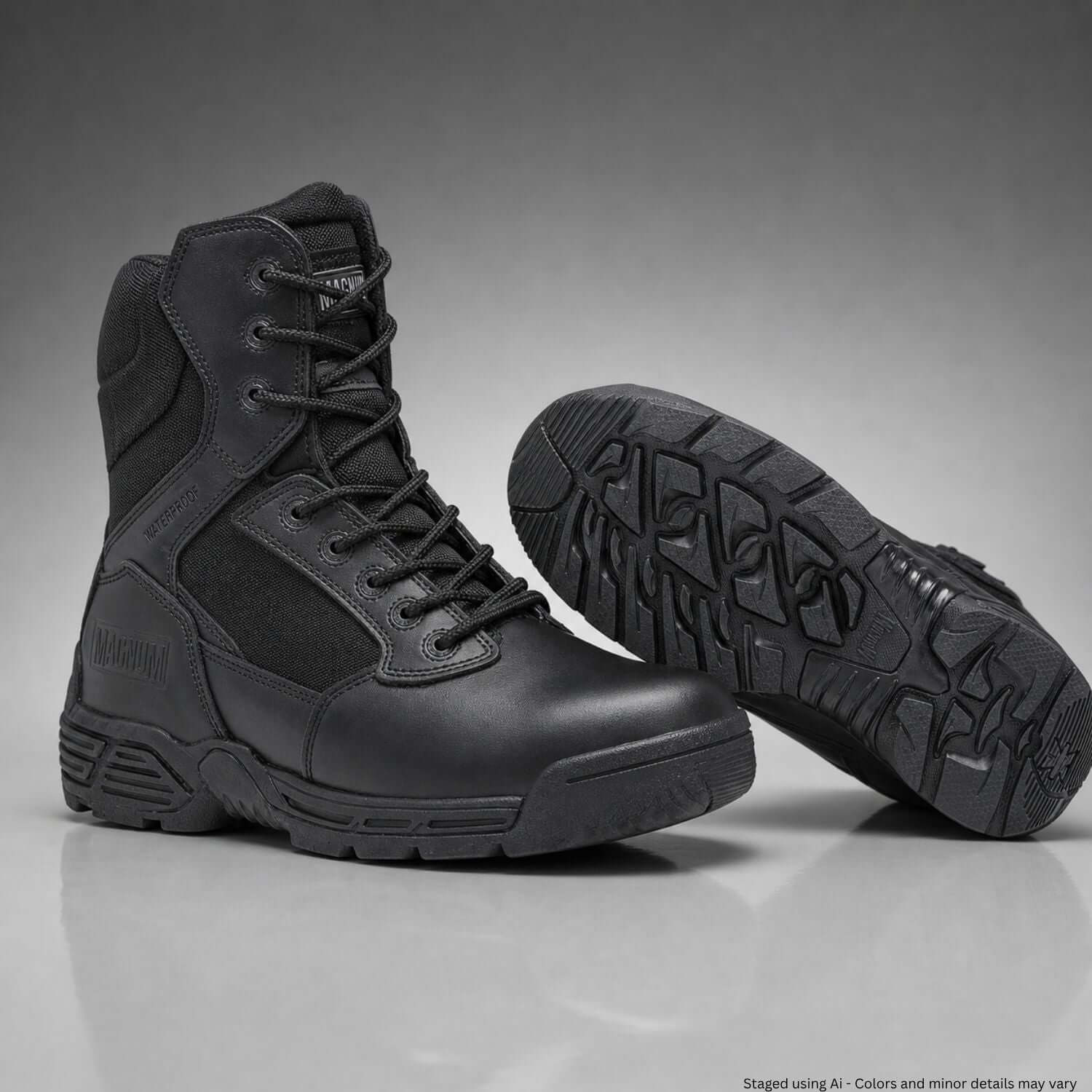 Black tactical boots on a gray background