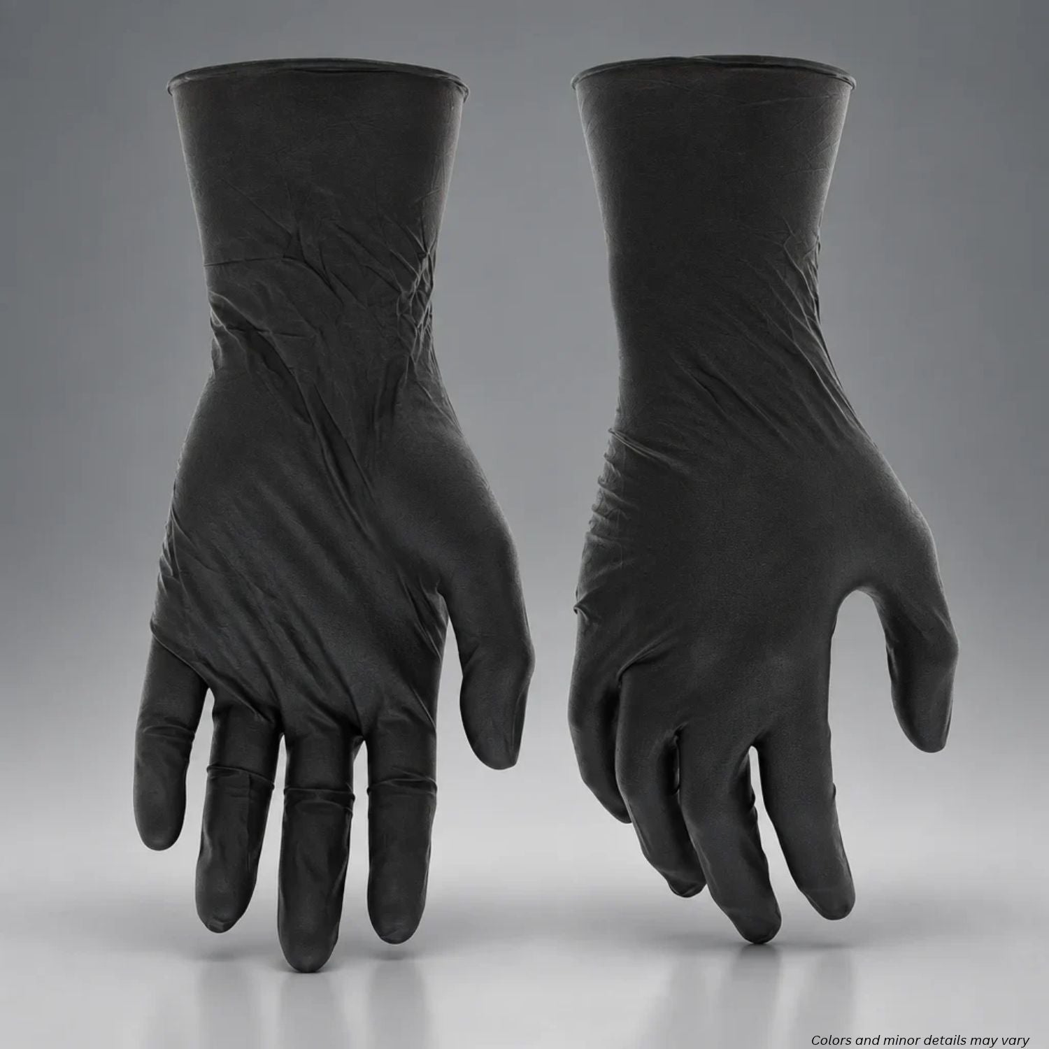 A pair of black nitrile gloves shown upright against a smooth gray studio background, with both gloves facing inward to display the back and side of the material.