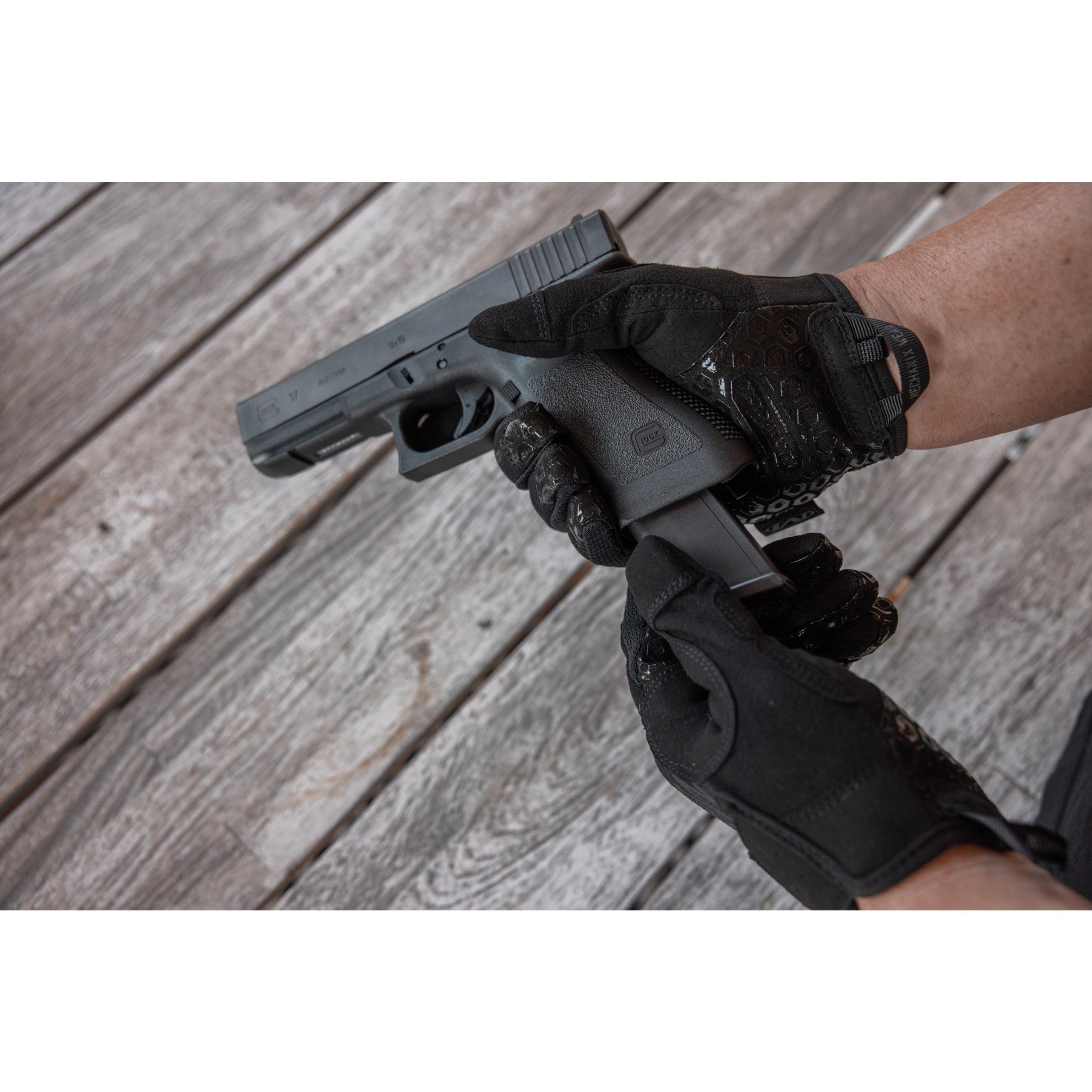 Mechanix Wear Precision Pro gloves handling a handgun during range training
