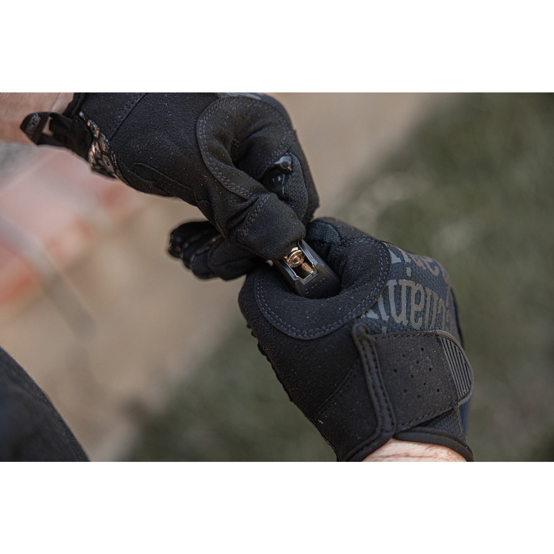 Mechanix Wear Precision Pro gloves loading a pistol magazine during shooting range training
