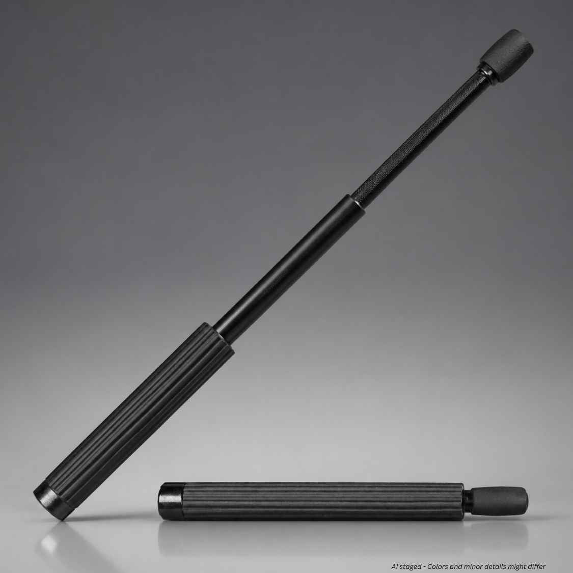 A black Monadnock Autolock expandable baton with a ribbed handle and a rounded tip, shown in both extended and folded positions on a gray studio background.