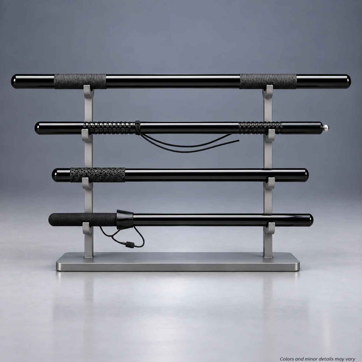 Monadnock MP polycarbonate straight batons 1000036 series in four grip styles on a display stand