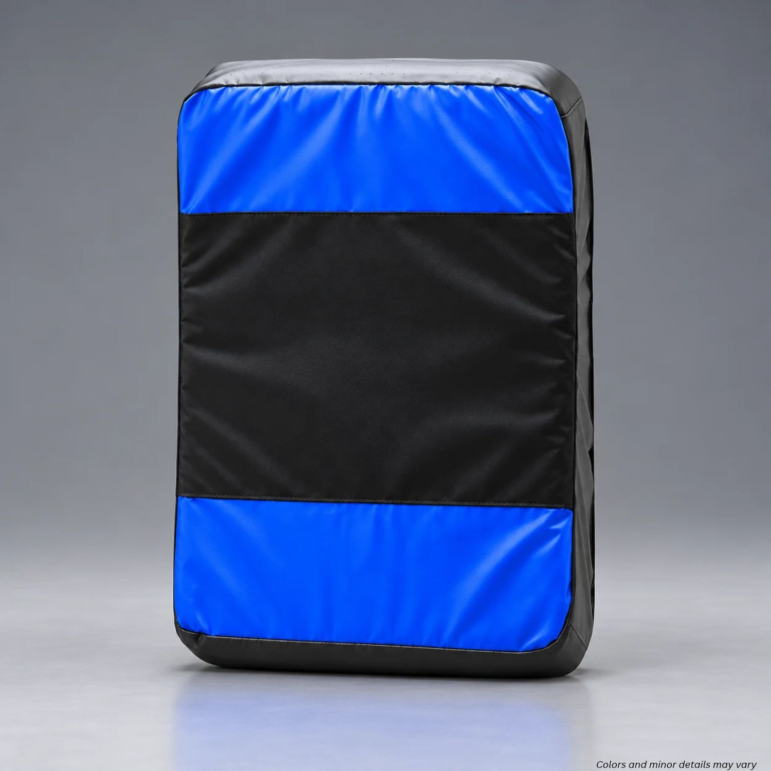 Monadnock UTB strike face with black center panel and blue padded ends