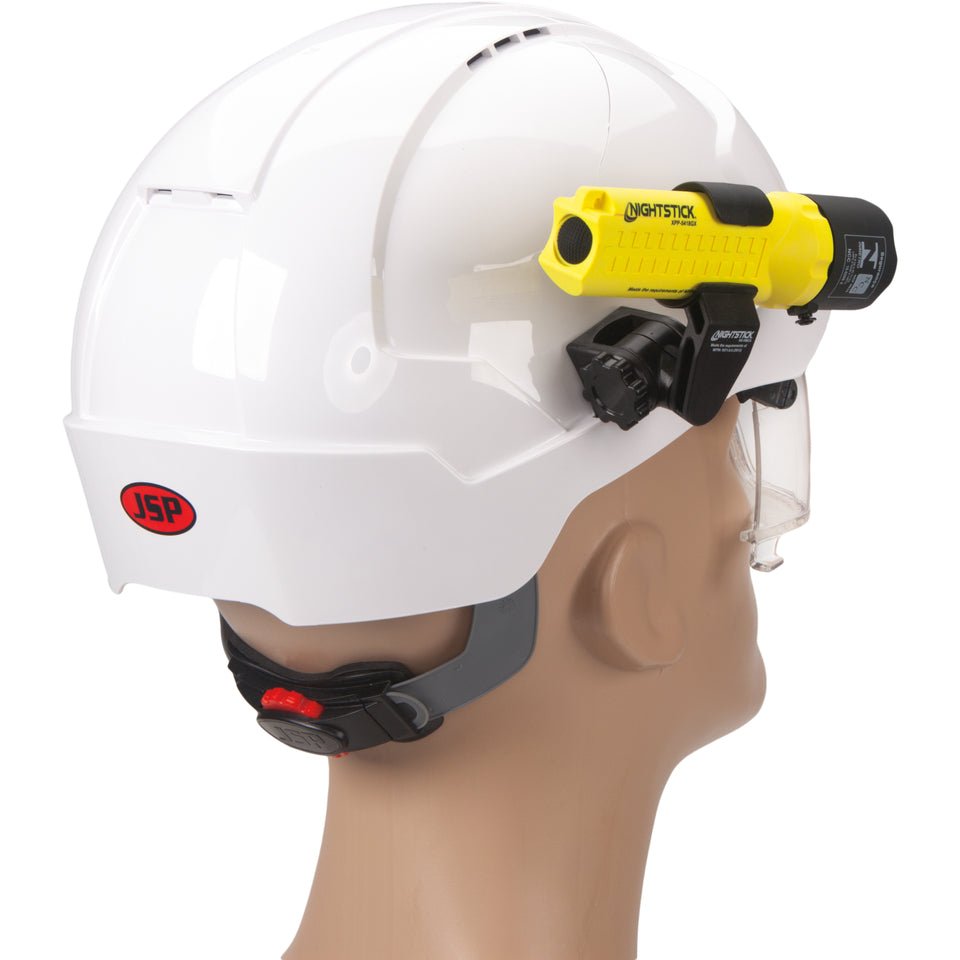 Nightstick XPP-5418GX-K01 flashlight mounted on the side of a hard hat with multi-angle mount