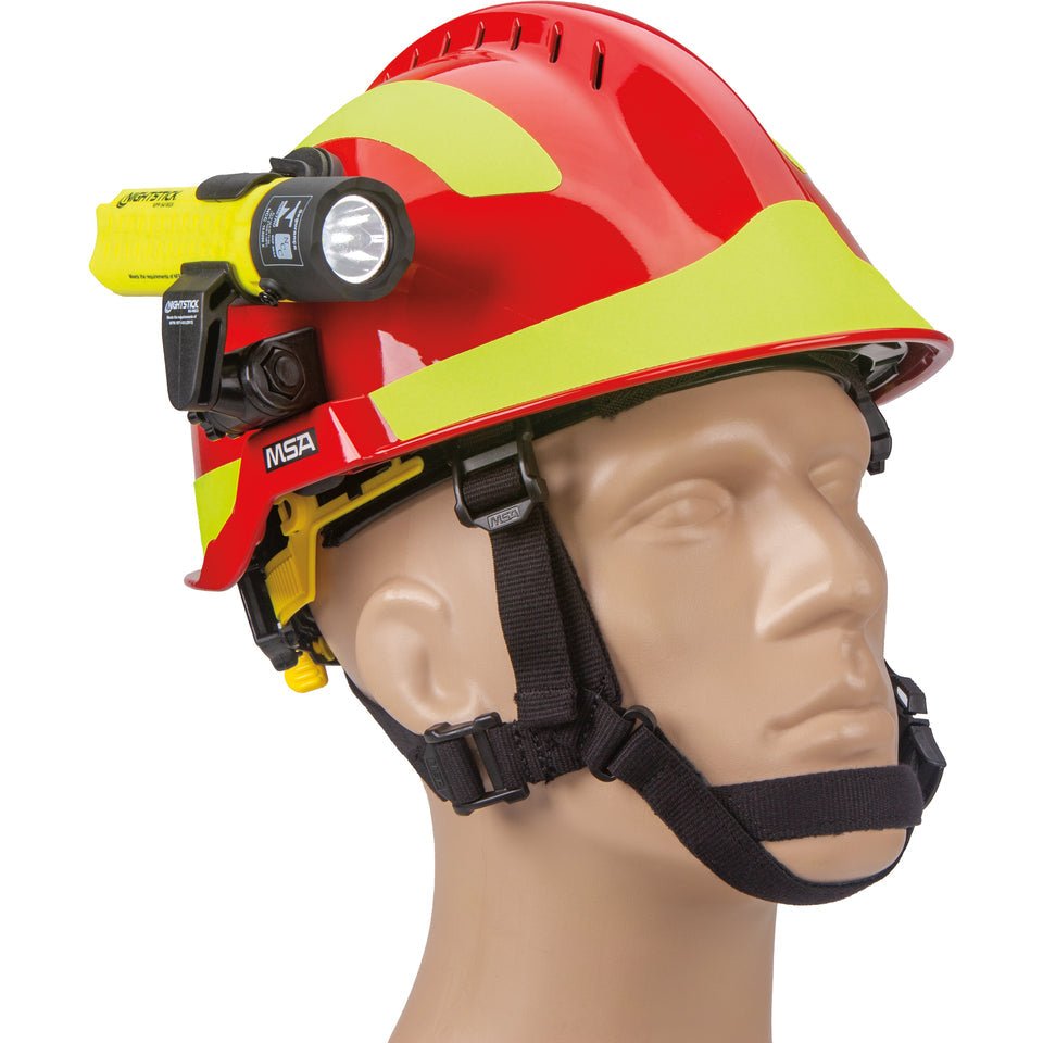Nightstick XPP-5418GX-K01 flashlight mounted on the front of a red fire helmet