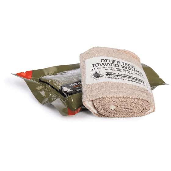 North American Rescue 4 inch Flat Emergency Trauma Dressing 30-0093, beige vacuum-sealed flat-folded sterile package showing front label