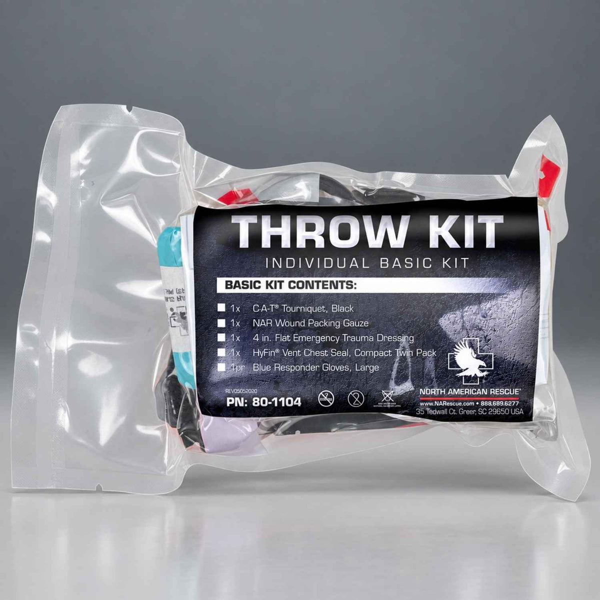 A sealed plastic pouch containing a throw kit with a large black front label reading 'THROW KIT' and listing contents, photographed on a gray studio background.