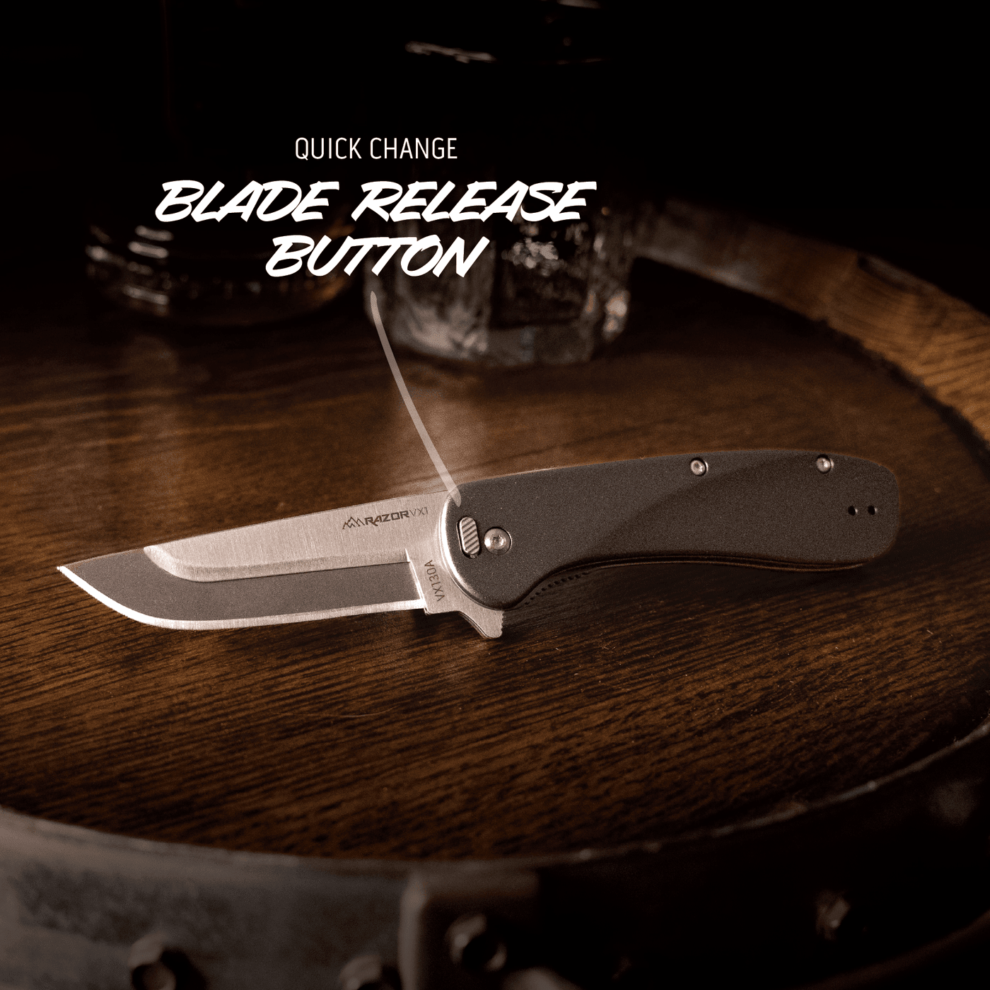 Folding knife with blade release button on a wooden surface
