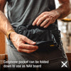 Person adjusting a black bag with a cellphone pocket, text indicating it can be folded down to use as a NAV board.