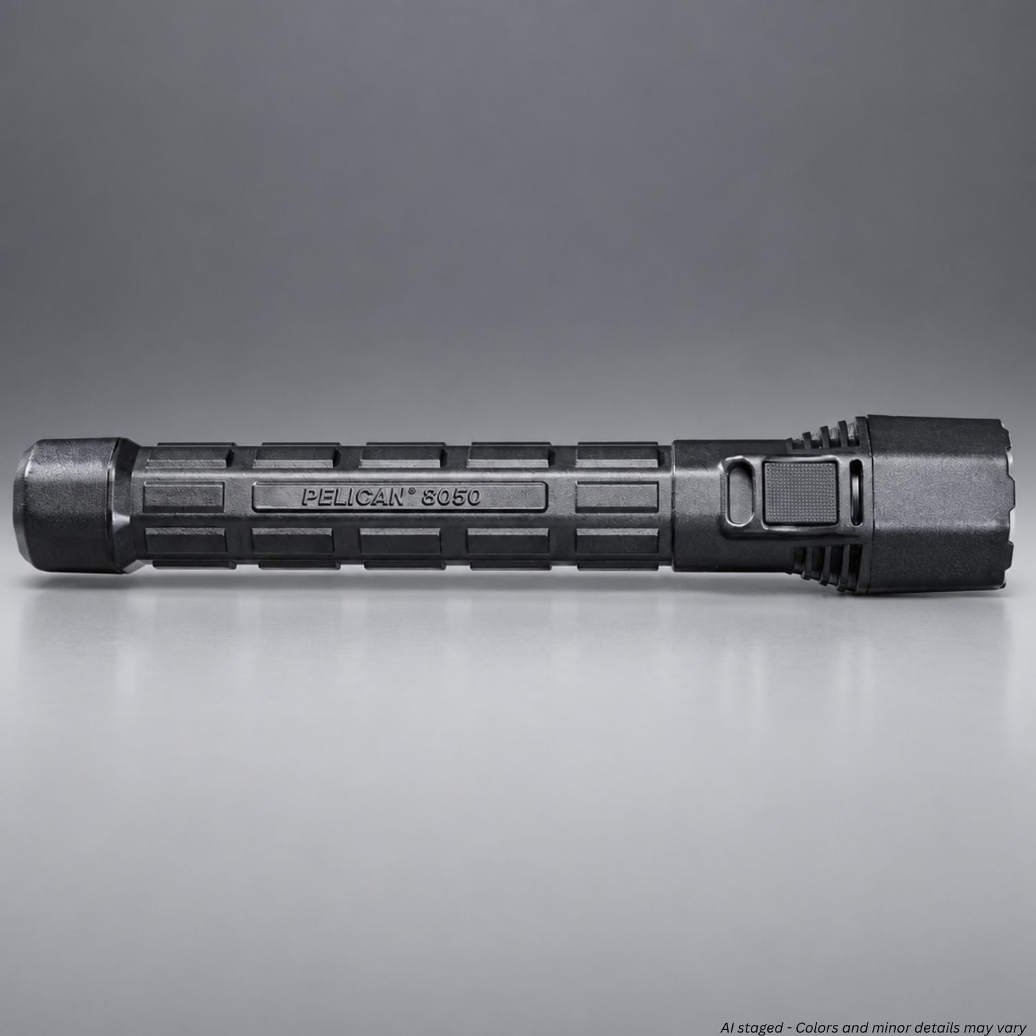 Pelican M11 8050 rechargeable flashlight in black, side view showing textured grip and switch