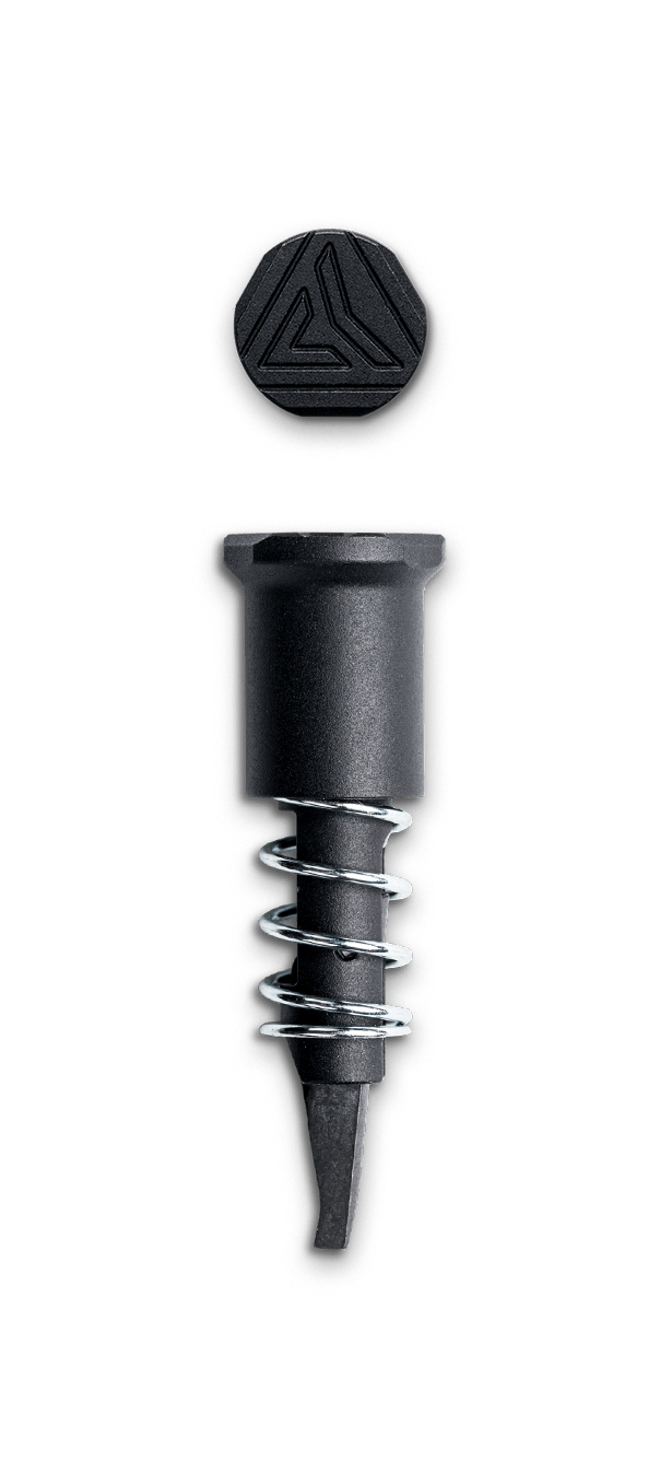 Radian Forward Assist component in black aluminum with spring, designed for AR15, featuring a stylish hex top.