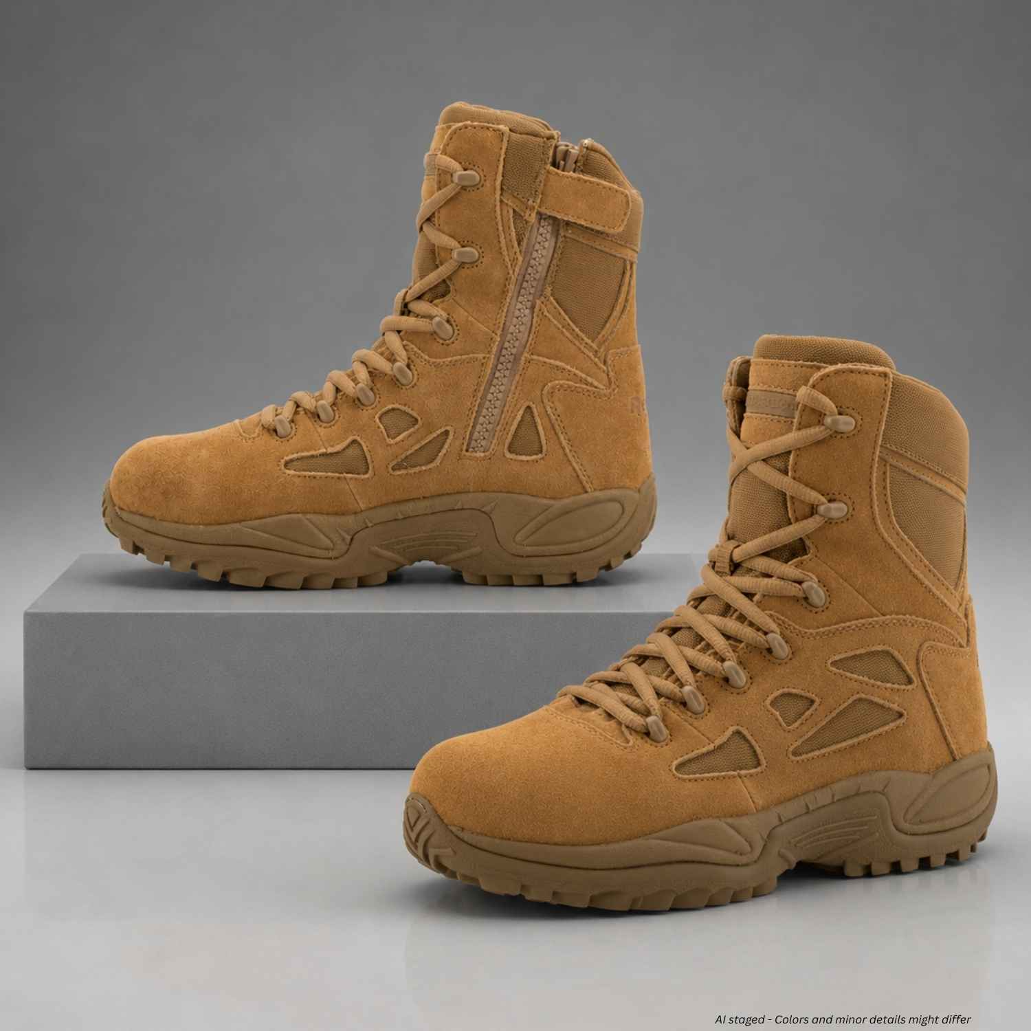 Pair of Reebok Rapid Response RB8850 coyote composite toe boots displayed on gray studio plinths