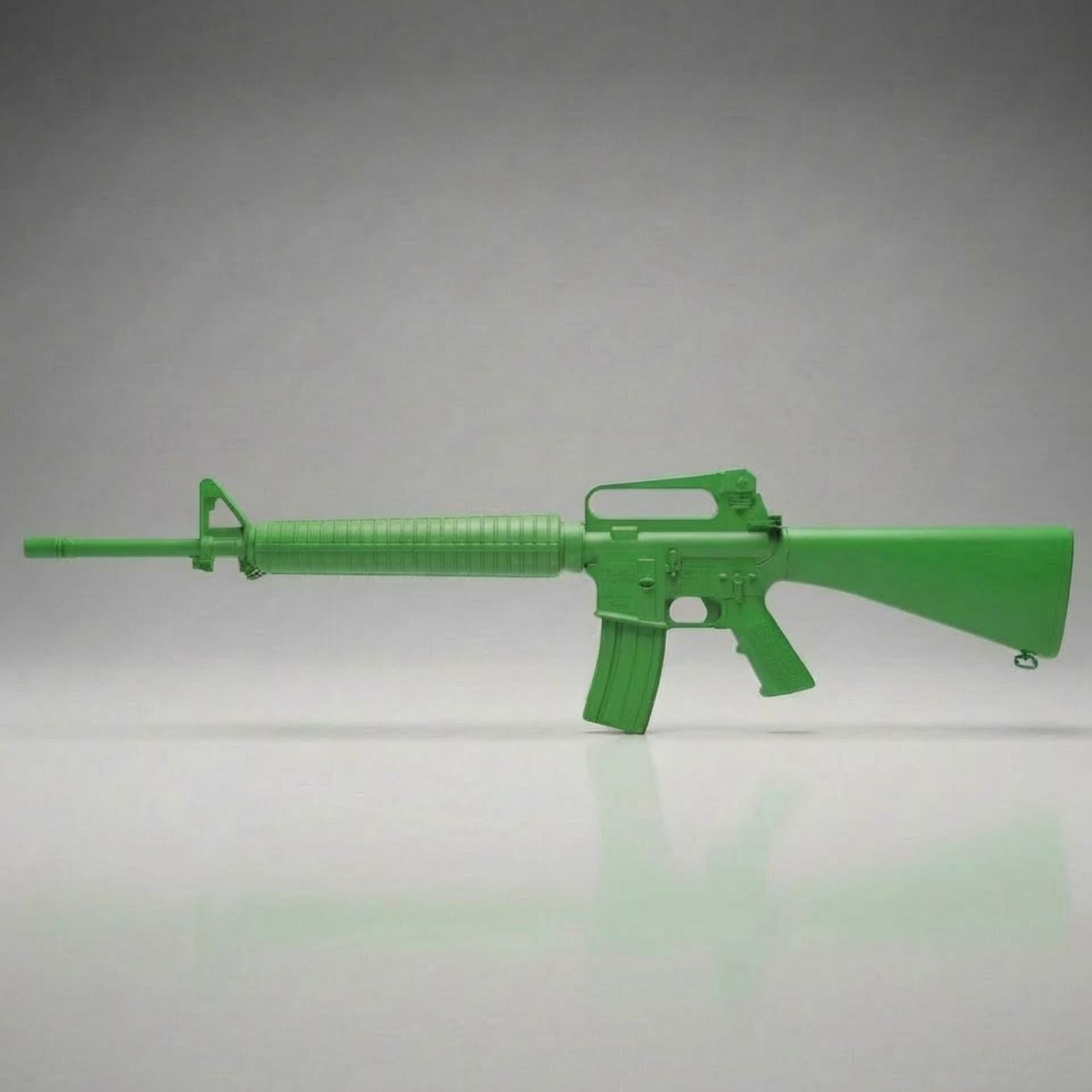 Green training rifle on a gray background for police training