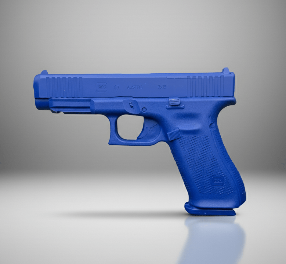 Ring's BlueGuns Glock 47 MOS firearm simulator in blue on a reflective gray surface