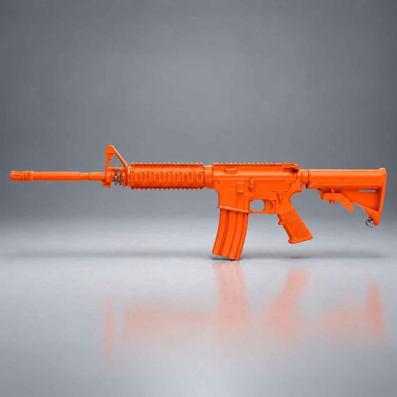 Orange Ring's BlueGuns M4 FSM4FTRCS training rifle with flat top, closed stock and forward rail, side view.