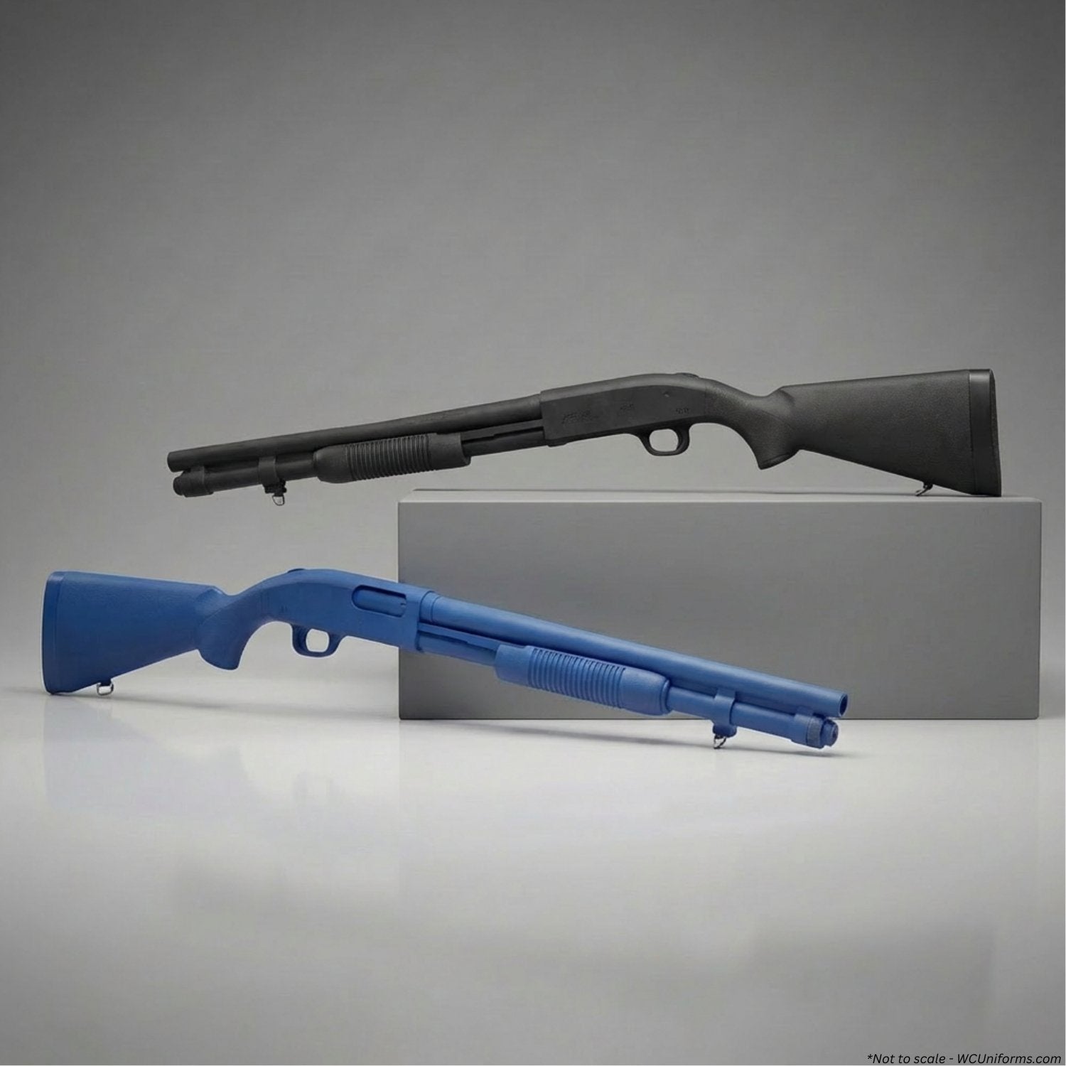 Two training shotguns, one blue and one black, on a gray background