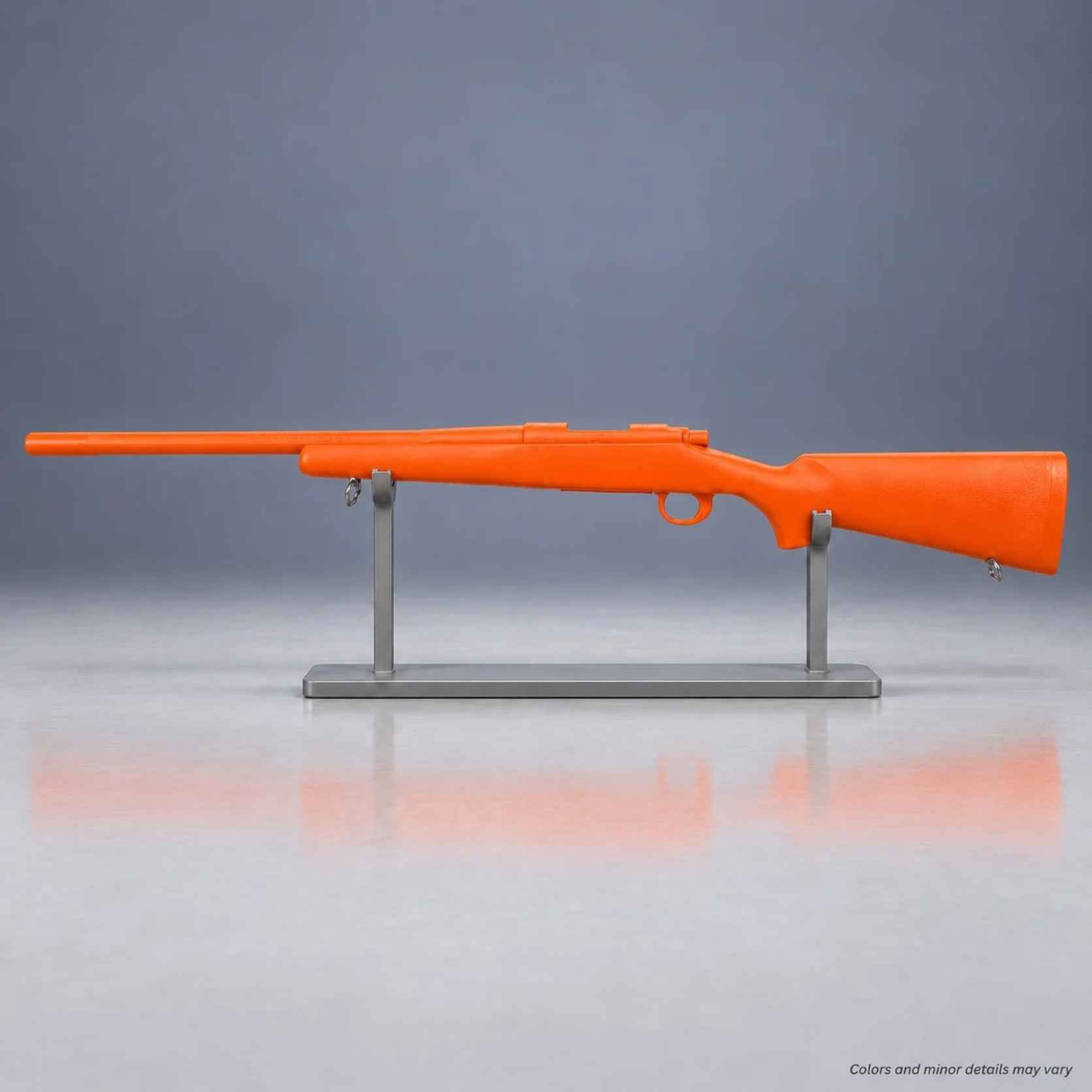 Orange Ring's BlueGuns Remington 700 FS700O high-visibility training rifle on a display stand