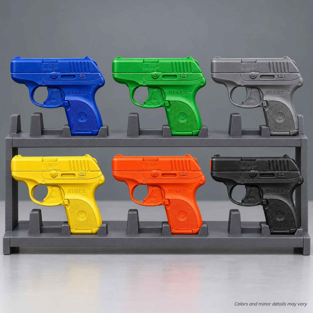 Ring's BlueGuns Ruger LCP .380 FSLCP training guns in blue, black, gray, green, orange, and yellow on a display rack