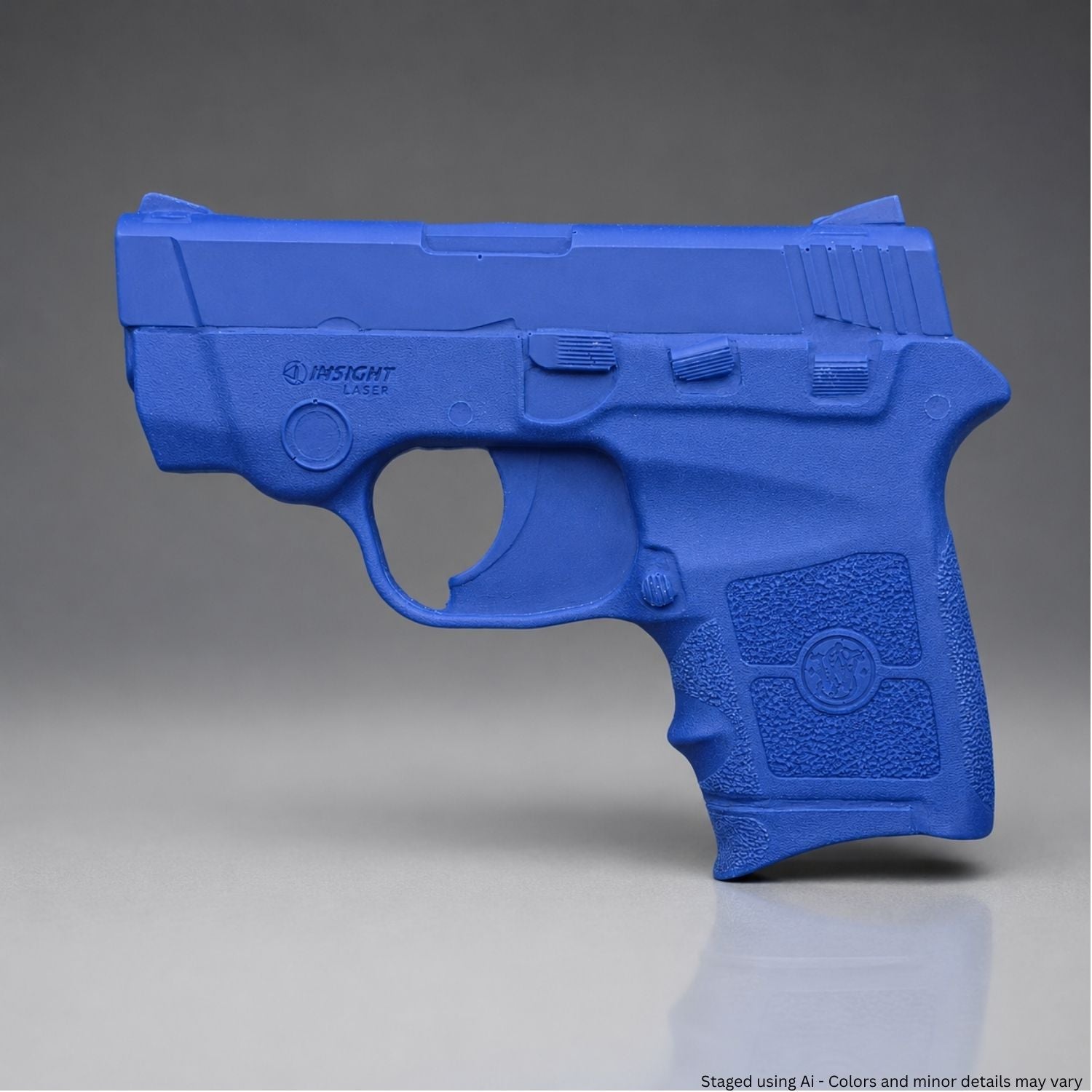 A Blue Smith & Wesson Bodyguard .380 Training Gun on a gray background| FSBG380