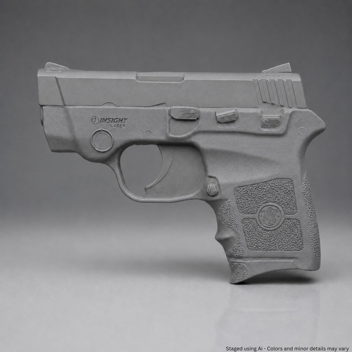A Gray Smith & Wesson Bodyguard .380 Training Gun on a gray background