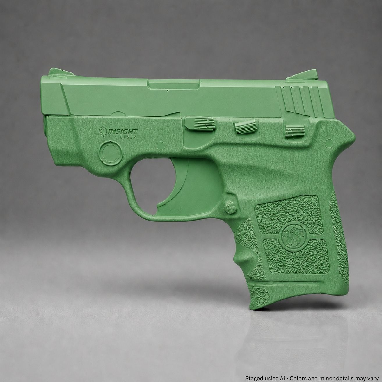 A Green Smith & Wesson Bodyguard .380 Training Gun on a gray background