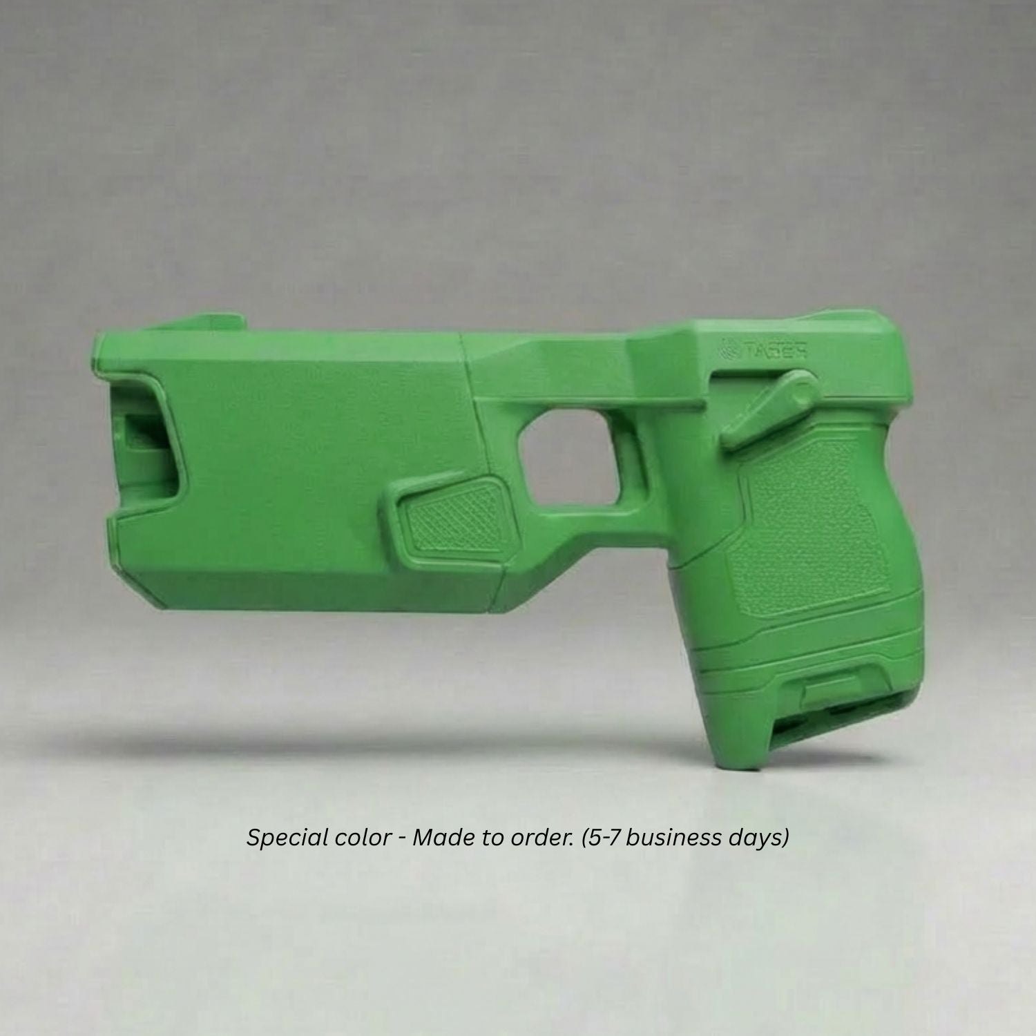 Blue Training Guns By Rings Green TASER 7 Simulator on a gray background