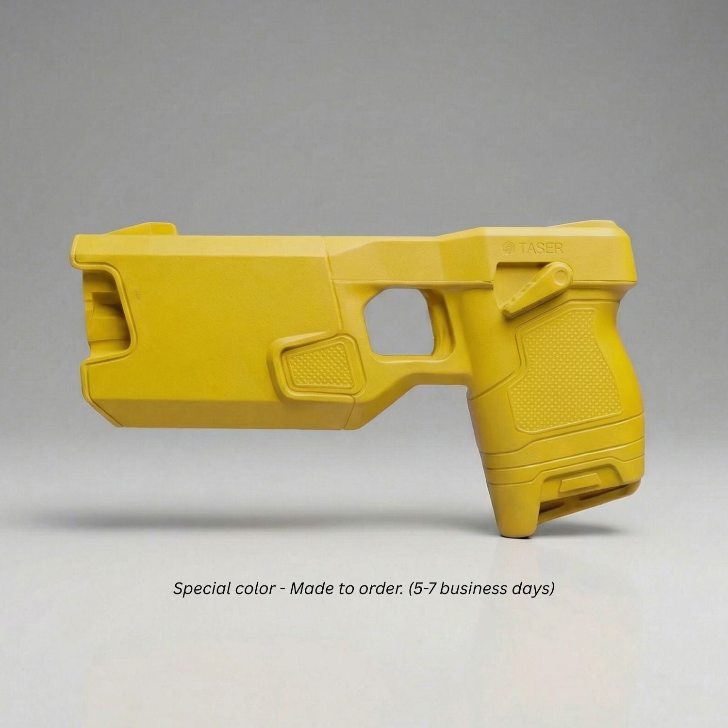Blue Training Guns By Rings Yellow TASER 7 Simulator on a gray background