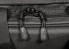 Close-up of a textured gray bag with black zippers and visible brand name.
