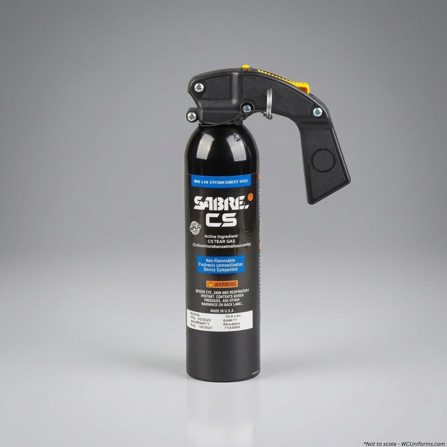 Black pepper spray canister with visible branding on a gray background