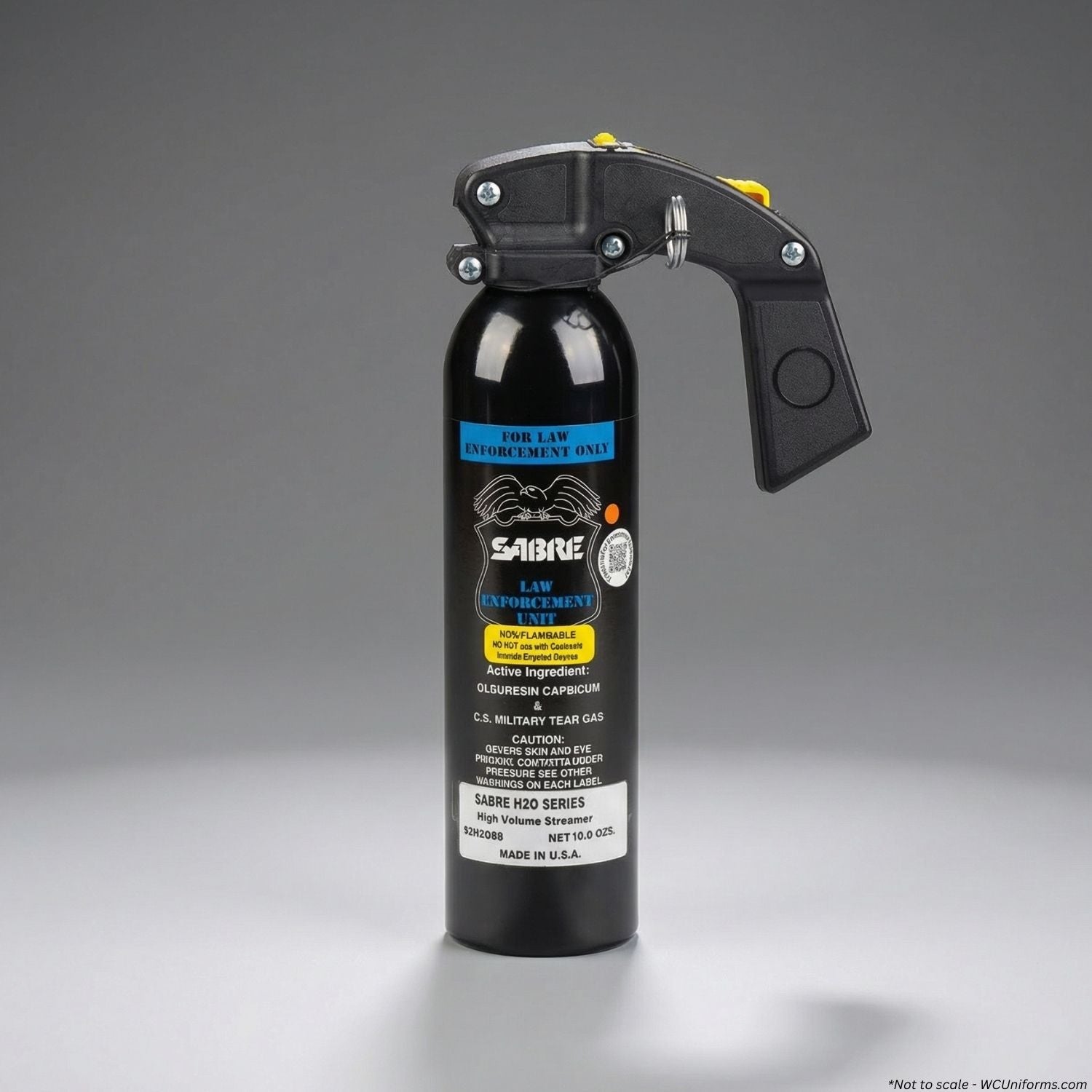 Black pepper spray canister withSabre branding on a gray background