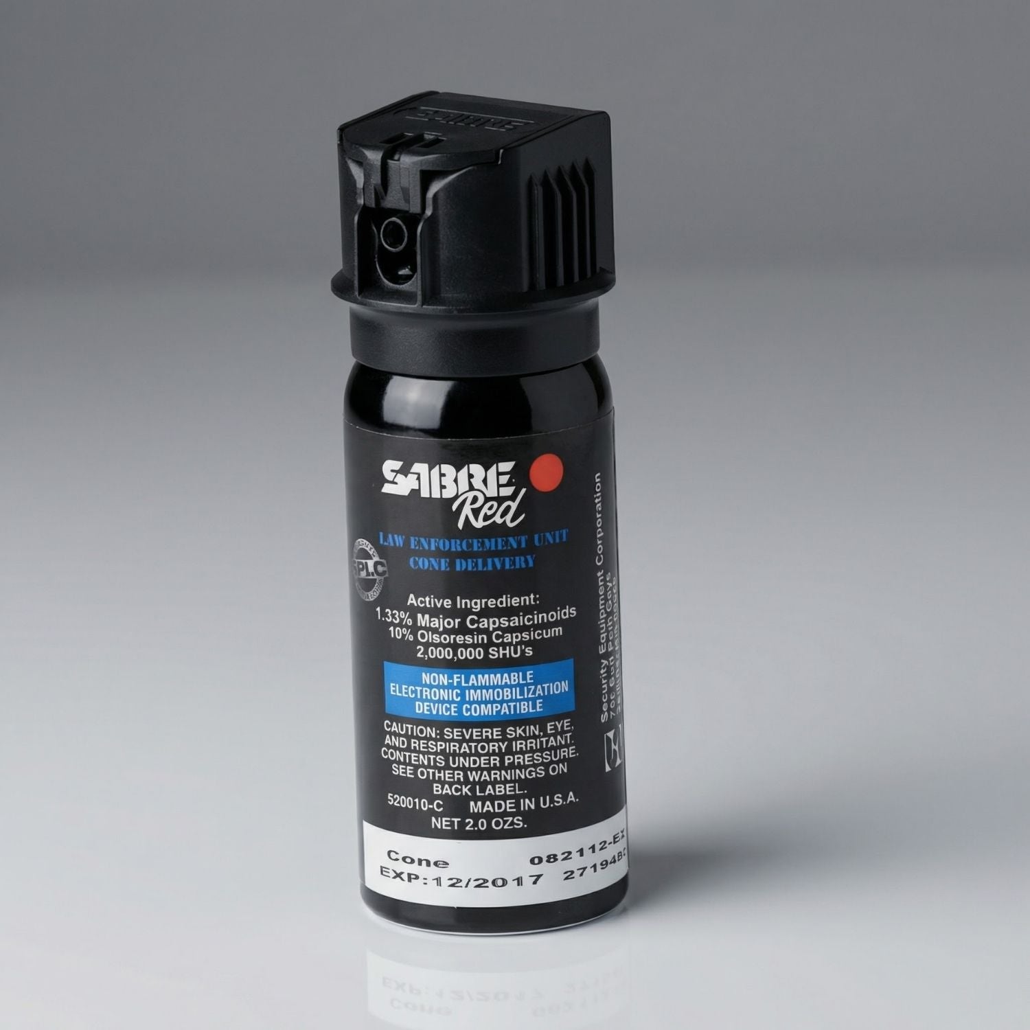 Sabre Red pepper spray canister on a gray background