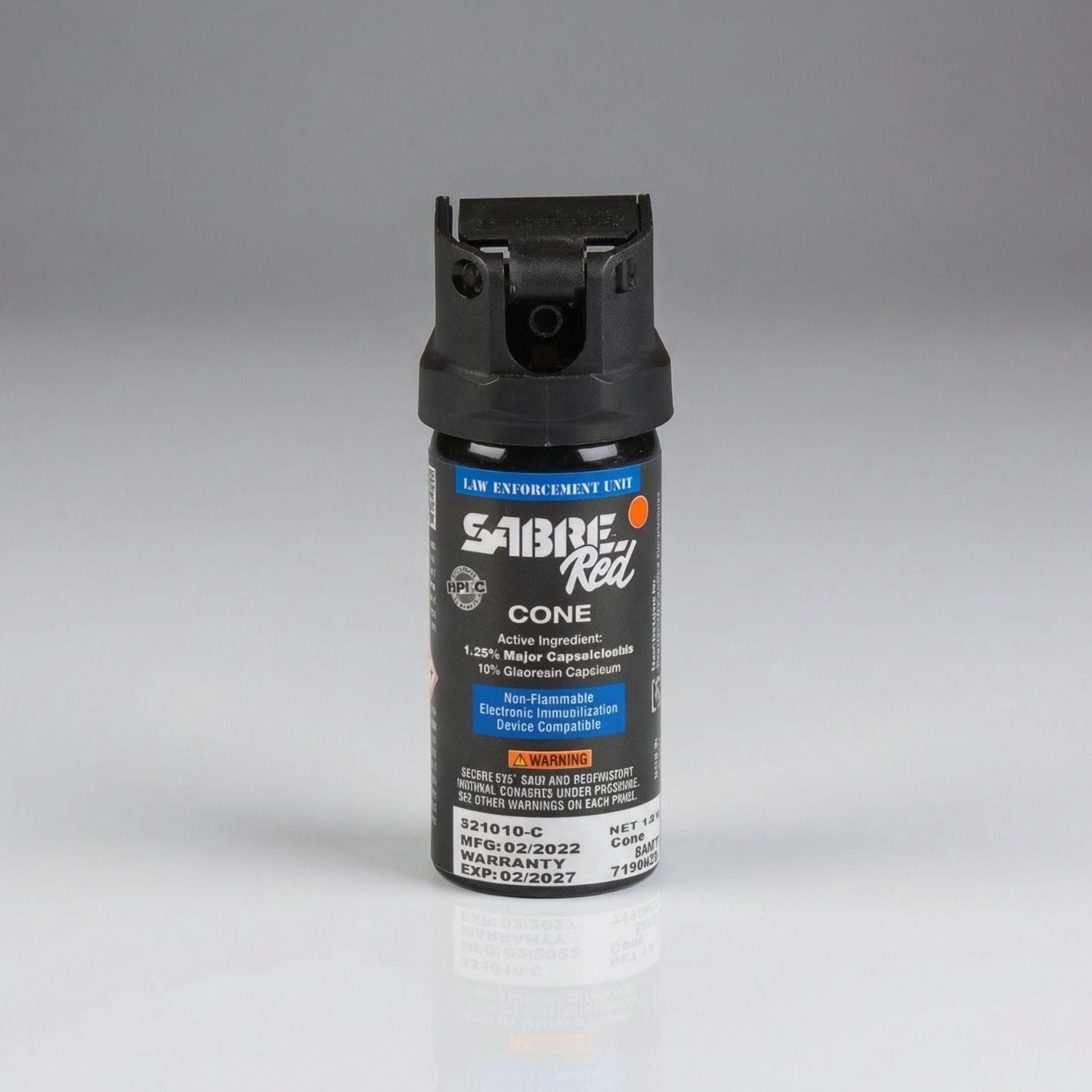 Black pepper spray canister with 'Sabre Red' branding on a gray background