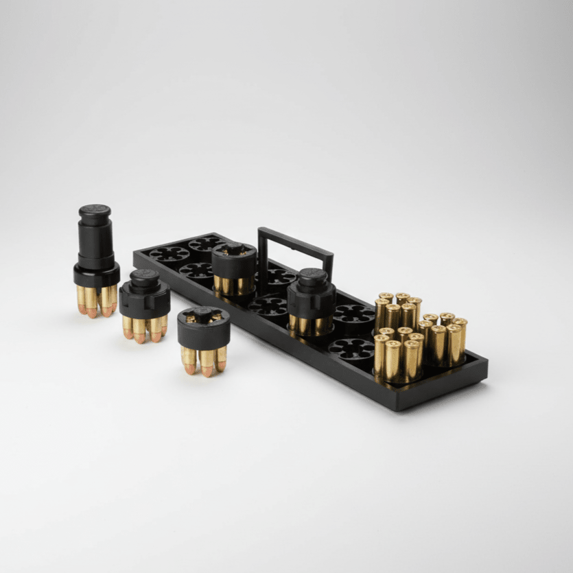 Black ammunition holder with brass bullets on a gray background