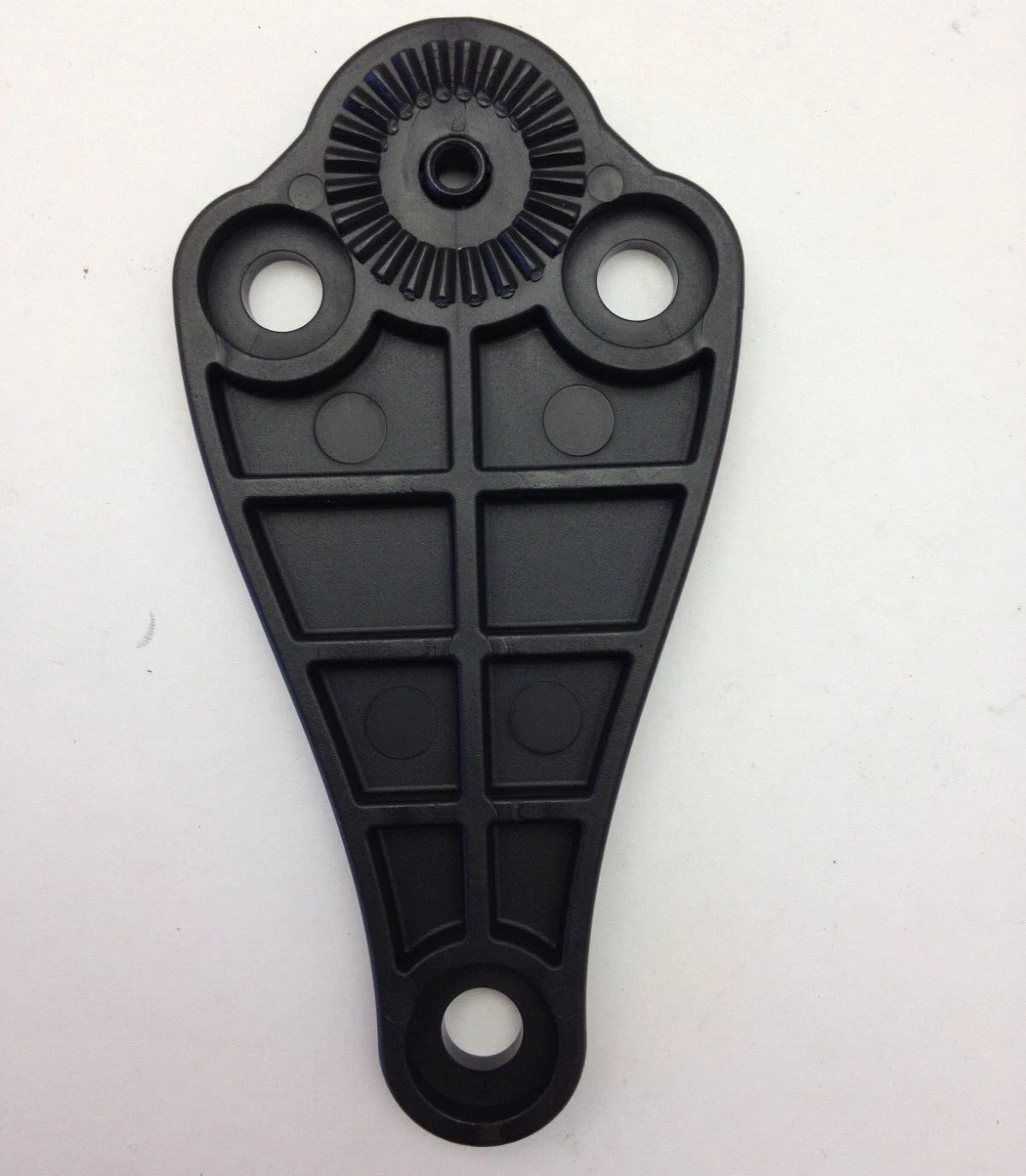 Black plastic component on a white background