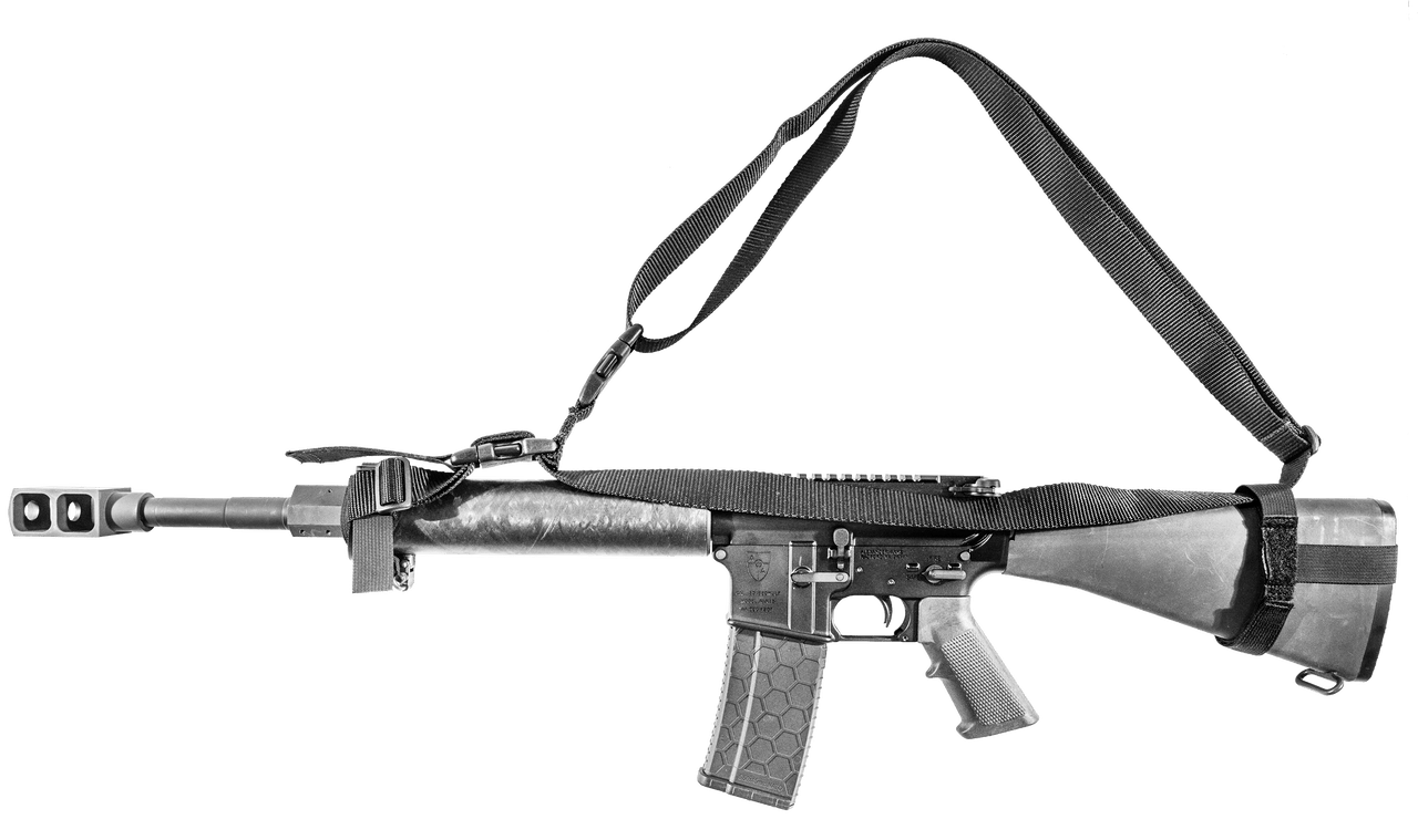 Sentry Fixed Stock Multi-Point Sling attached to a rifle, showcasing its durable nylon webbing and adjustable design.