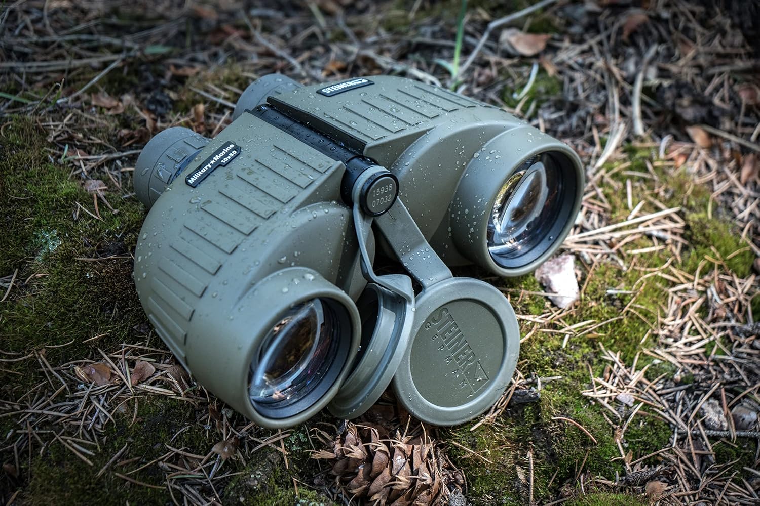 Steiner Binoculars Military-Marine 10x50, 7x50, or 8x30 Binoculars on a moss outdoor background