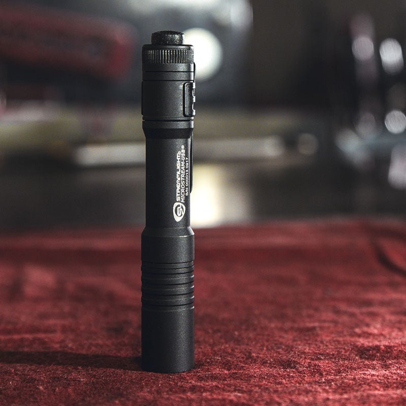 Black Streamlight MicroStream USB pocket flashlight standing upright
